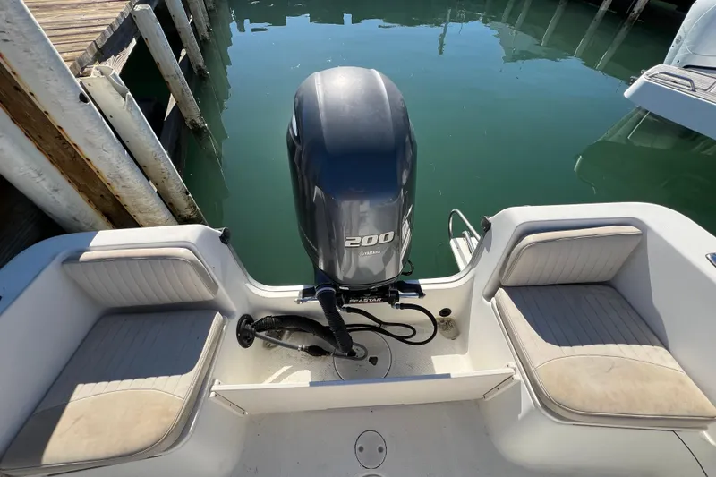 Slide: The Image of 2004 Hydra-Sports 212 CC boat with Yamaha 200 engine, docked at marina. - 28