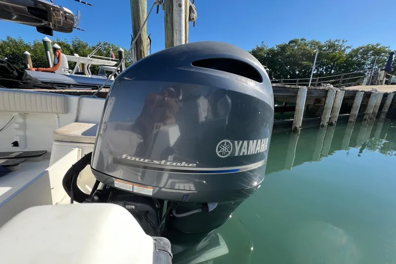 Slide: The Image of 2004 Hydra-Sports 212 CC boat with Yamaha four-stroke outboard engine at dock. - 29