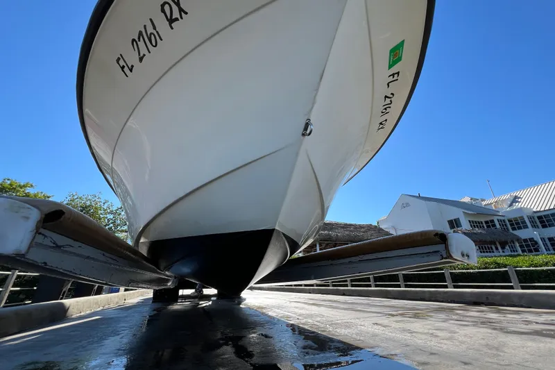 Slide: The Image of 2004 Hydra-Sports 212 CC boat on trailer, viewed from below, against clear blue sky. - 40