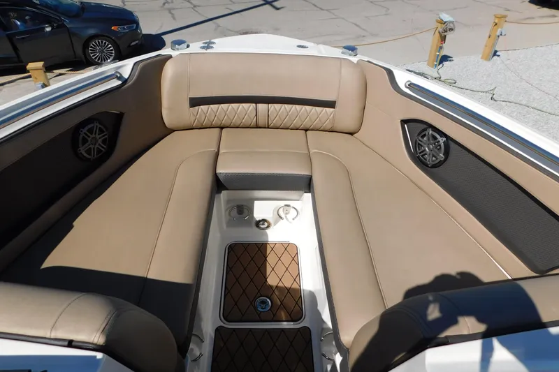 Slide: The Image of 2018 Sea Ray SLX-W 230 boat interior with tan seating and speaker system. - 30