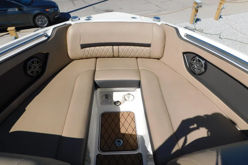 Slide: The Image of 2018 Sea Ray SLX-W 230 boat interior with tan seating and speaker system. - 36