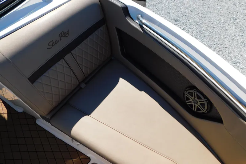 Slide: The Image of 2018 Sea Ray SLX-W 230 boat interior with quilted seating and speaker detail. - 37