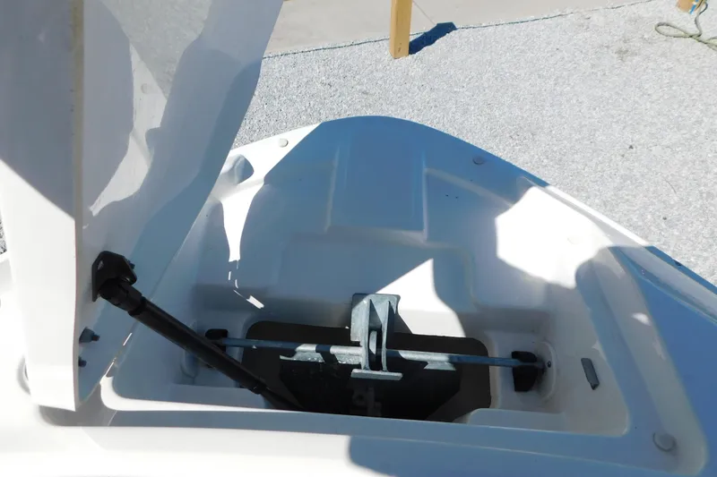 Slide: The Image of Open anchor compartment of 2018 Sea Ray SLX-W 230 boat, showing storage details. - 41