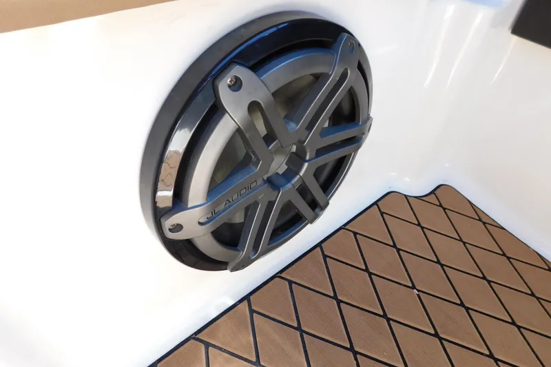 Slide: The Image of JL Audio speaker on 2018 Sea Ray SLX-W 230 boat with diamond-pattern flooring. - 44