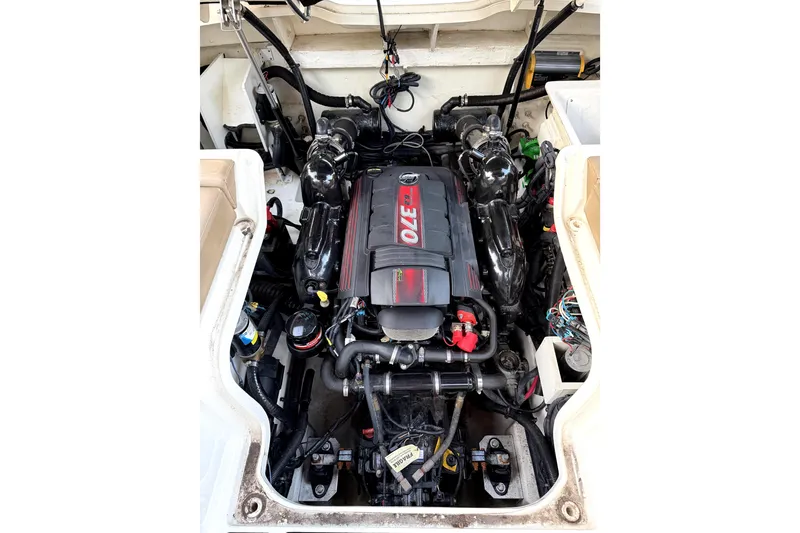 Slide: The Image of Engine compartment of a 2018 Sea Ray SLX-W 230 boat, showcasing a powerful 370 HP engine. - 62