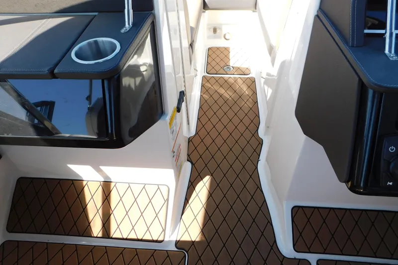 Slide: The Image of Interior view of a 2018 Sea Ray SLX-W 230 boat with stylish flooring and seating. - 48