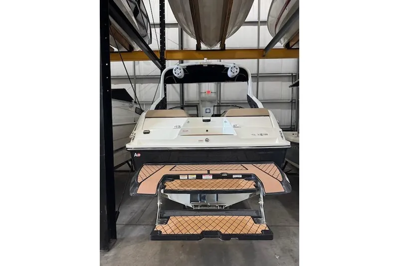 Slide: The Image of 2018 Sea Ray SLX-W 230 boat in storage, rear view. - 5