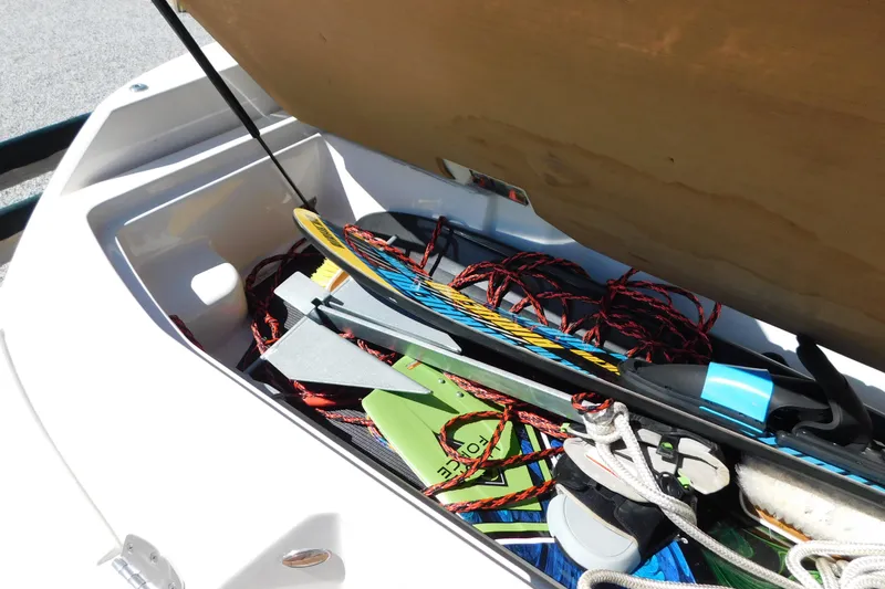 Slide: The Image of Storage compartment of 2018 Sea Ray SLX-W 230 boat with watersports equipment. - 58