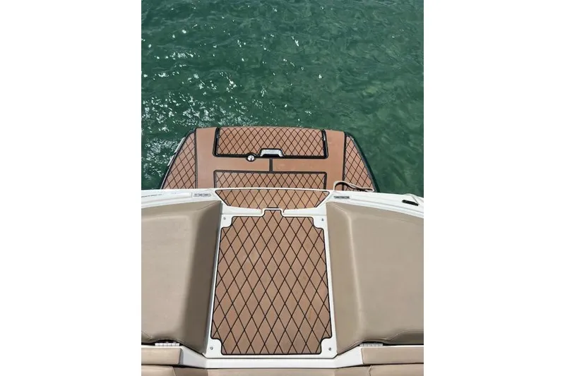 Slide: The Image of 2018 Sea Ray SLX-W 230 swim platform with diamond-patterned decking on water. - 6