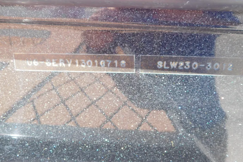 Slide: The Image of 2018 Sea Ray SLX-W 230 boat identification numbers on a glittery surface. - 61