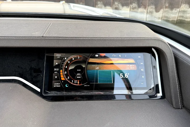 Slide: The Image of Dashboard of a 2018 Sea Ray SLX-W 230 boat displaying speed and settings. - 63
