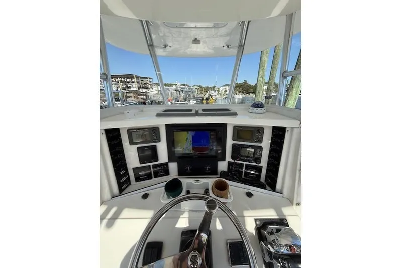 Slide: The Image of 1999 Venture 34 Open boat helm with navigation equipment and steering wheel. - 6