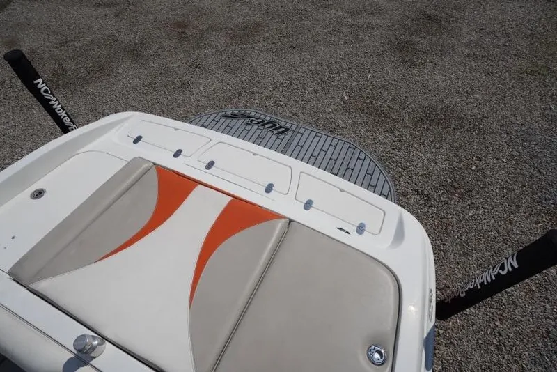 Slide: The Image of 2008 Tigé 24Ve boat with orange and beige seating, rear view. - 11