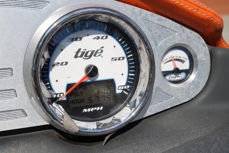 Slide: The Image of Dashboard of a 2008 Tigé 24Ve boat showing speedometer and gauges. - 16