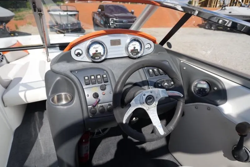 Slide: The Image of 2008 Tigé 24Ve boat dashboard with steering wheel and control panel. - 7