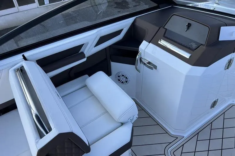 Slide: The Image of 2025 Cobalt R6 boat interior with white seating and modern dashboard design. - 12
