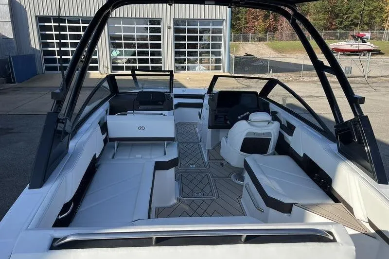 Slide: The Image of 2025 Cobalt R6 boat interior with sleek seating and modern dashboard design. - 17