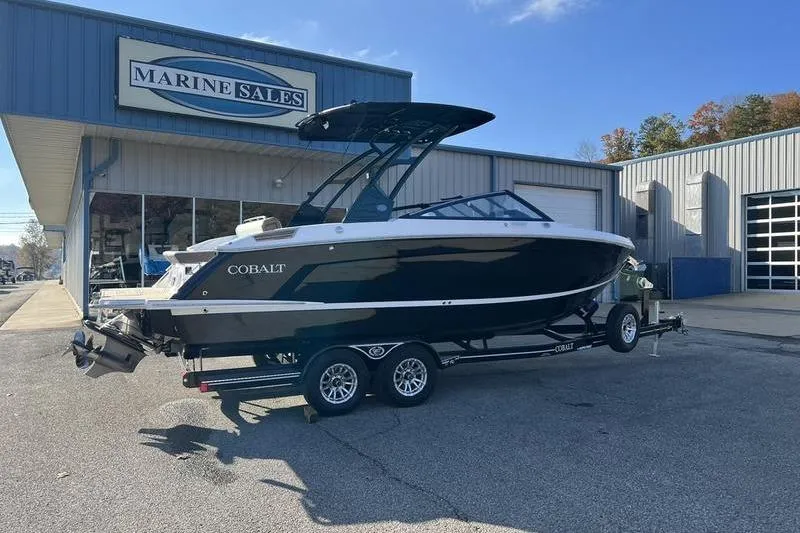 Slide: The Image of 2025 Cobalt R6 boat on trailer outside Marine Sales building. - 22