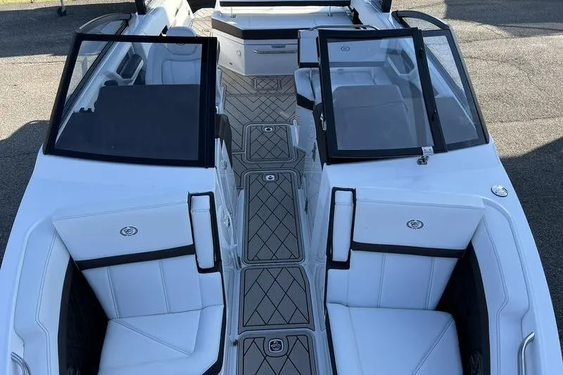 Slide: The Image of 2025 Cobalt R6 boat interior with white seating and sleek design. - 4