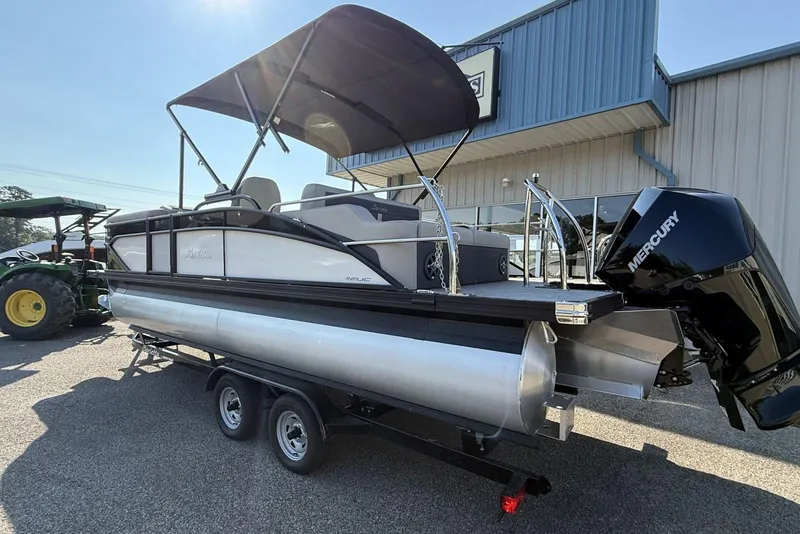 Slide: The Image of 2025 Barletta Cabrio 22UC pontoon boat with Mercury engine on trailer. - 10