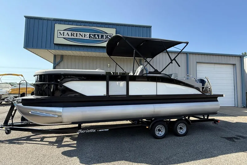Slide: The Image of 2025 Barletta Cabrio 22UC pontoon boat on trailer at Marine Sales dealership. - 8