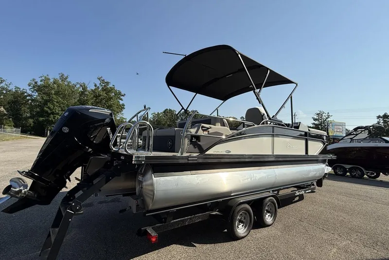 Slide: The Image of 2025 Barletta Cabrio 22UC pontoon boat on trailer, featuring sleek design and canopy. - 9