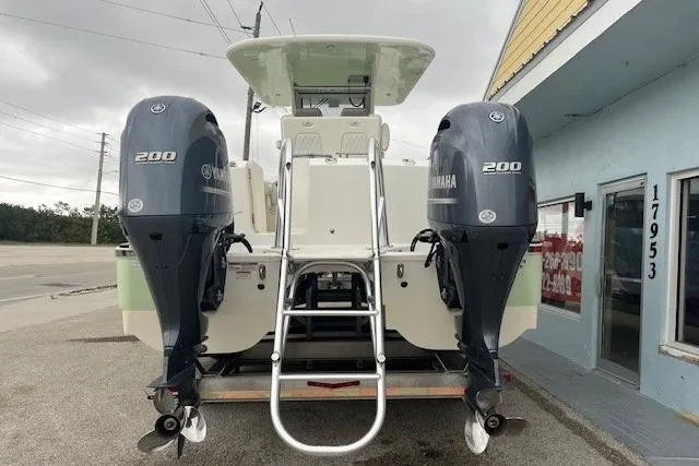 Slide: The Image of 2023 World Cat 280 CC-X boat with dual Yamaha 200 engines, rear view. - 2