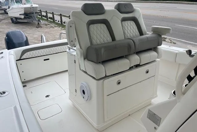 Slide: The Image of 2023 World Cat 280 CC-X boat interior with dual cushioned seats and storage. - 6