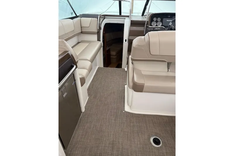 Slide: The Image of 2015 Formula 310 Sun Sport interior with beige seating and modern dashboard. - 12