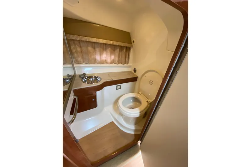 Slide: The Image of 2015 Formula 310 Sun Sport boat bathroom with sink and toilet. - 18