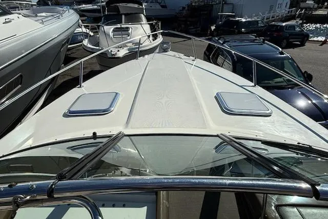 Slide: The Image of 2015 Formula 310 Sun Sport boat docked among other vessels. - 20