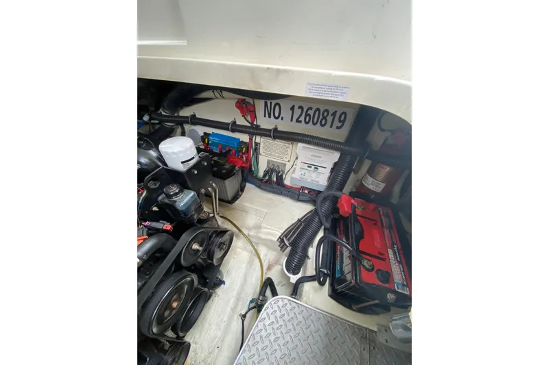 Slide: The Image of Engine compartment of a 2015 Formula 310 Sun Sport boat, showing mechanical components and wiring. - 26