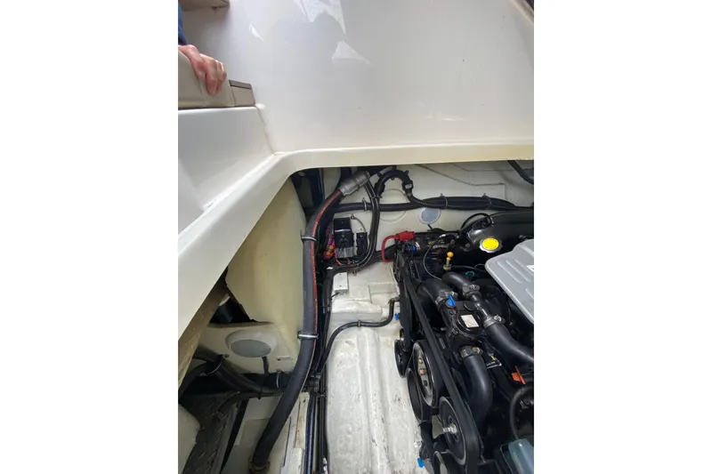 Slide: The Image of Engine compartment of a 2015 Formula 310 Sun Sport boat, showcasing mechanical components. - 28