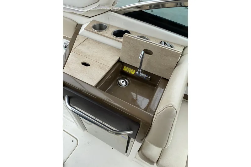 Slide: The Image of 2015 Formula 310 Sun Sport boat interior with sink and cup holders. - 9