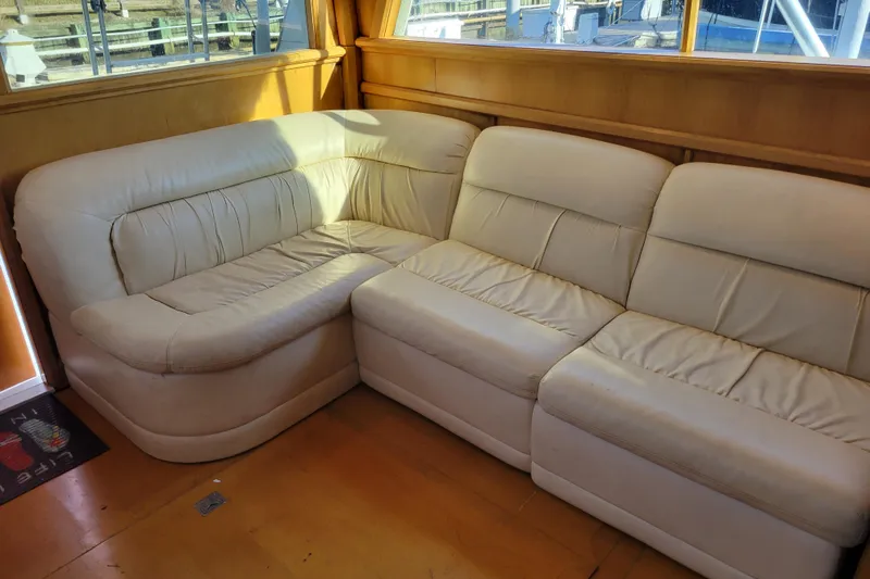 Slide: The Image of Cream leather sofa in 1979 Bertram 38 Convertible yacht interior. - 15