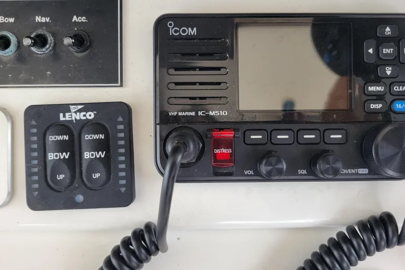 Slide: The Image of Control panel of a 1979 Bertram 38 Convertible with ICOM VHF radio and Lenco switches. - 33