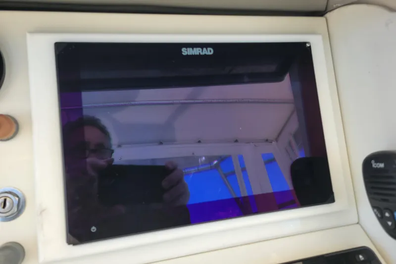 Slide: The Image of Simrad display on 1979 Bertram 38 Convertible boat dashboard. - 39