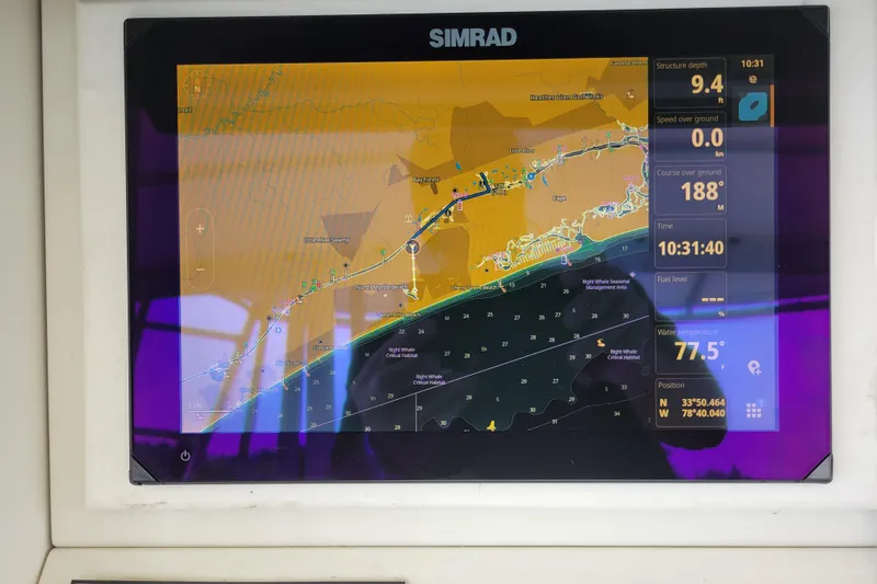 Slide: The Image of Simrad navigation display on a 1979 Bertram 38 Convertible boat, showing map and data. - 40