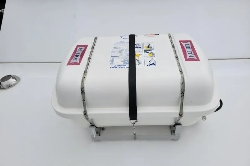 Slide: The Image of White life raft container on a 1979 Bertram 38 Convertible boat deck. - 48