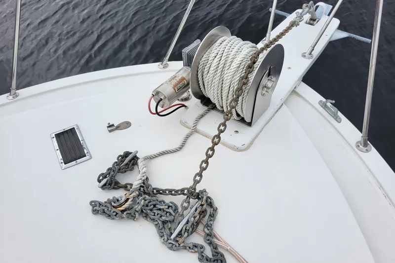 Slide: The Image of Anchor winch on 1979 Bertram 38 Convertible boat deck, with rope and chain. - 50