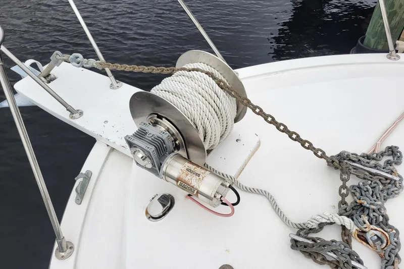 Slide: The Image of Anchor winch on 1979 Bertram 38 Convertible boat deck, with rope and chain. - 51