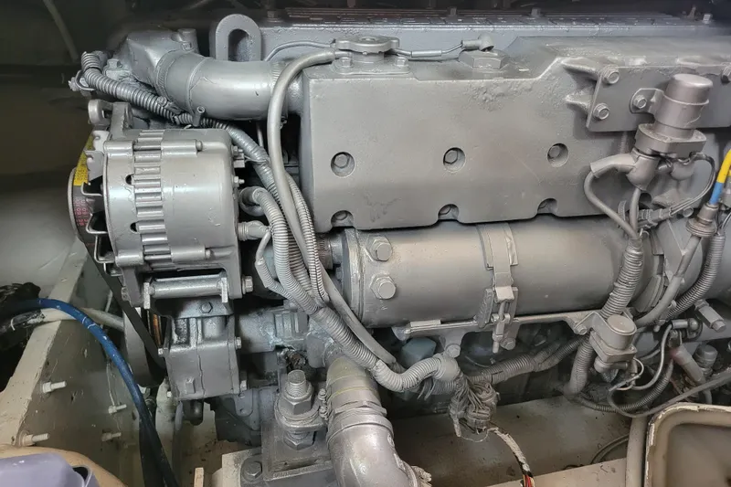 Slide: The Image of Engine of a 1979 Bertram 38 Convertible boat, showcasing detailed mechanical components. - 56