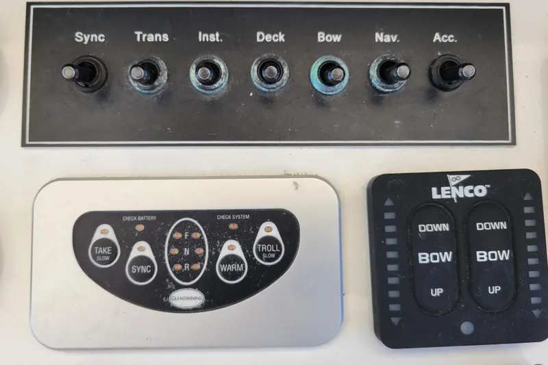Slide: The Image of Control panel of a 1979 Bertram 38 Convertible boat with switches and buttons. - 66