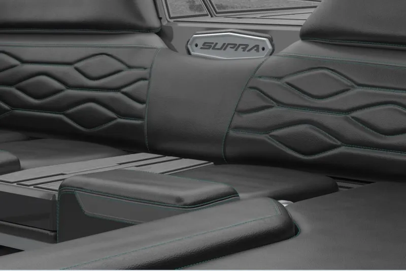 Slide: The Image of 2026 Supra SA interior with sleek black leather seats and modern design. - 2
