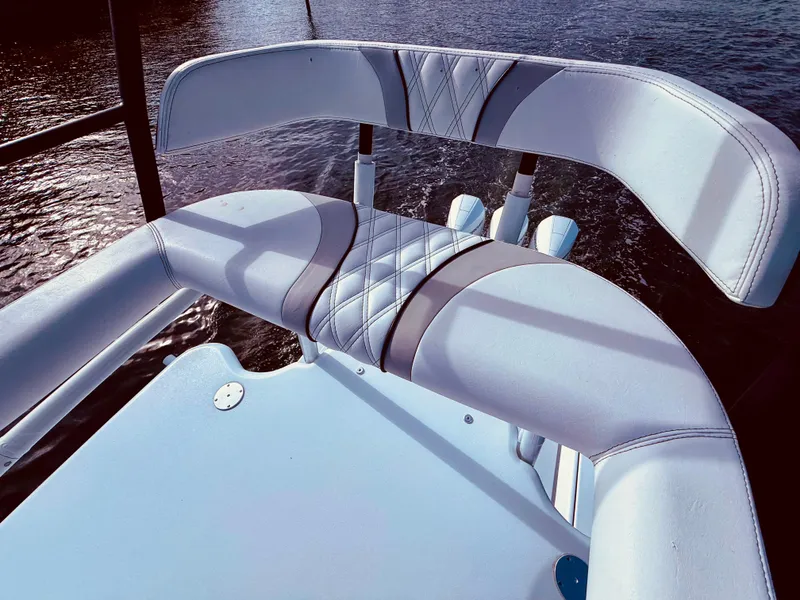 Slide: The Image of 2024 Contender 39 ST boat seat with quilted design, overlooking water. - 29