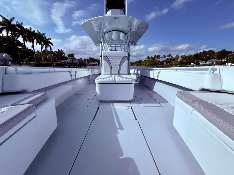 Slide: The Image of 2024 Contender 39 ST boat interior with sleek seating and open deck design. - 7