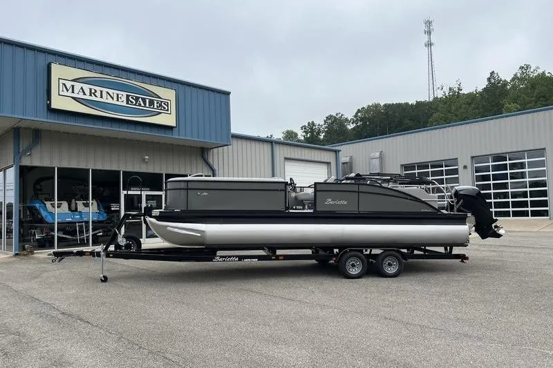The Image of 2025 Barletta Aria 24UC pontoon boat on trailer outside Marine Sales building. - 1