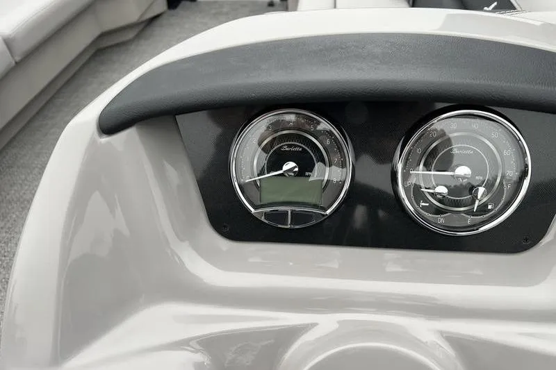 Slide: The Image of Dashboard of 2025 Barletta Aria 24UC boat with dual gauges. - 14