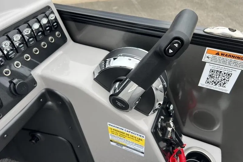 Slide: The Image of Control panel of 2025 Barletta Aria 24UC boat with throttle and switches. - 15