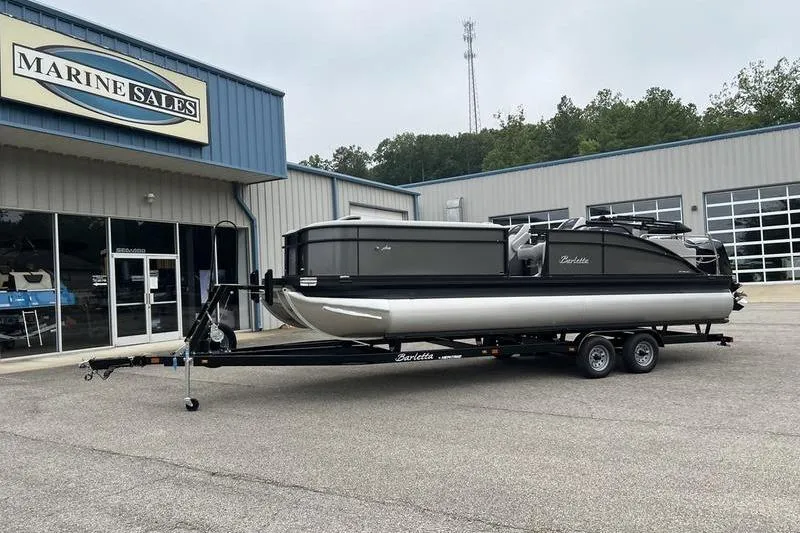 Slide: The Image of 2025 Barletta Aria 24UC pontoon boat on trailer at Marine Sales dealership. - 3